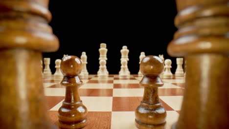 Chess-Board-Pieces,-Macro-Pull-Back-Across-Board-Between-Black-King-and-Queen,-Slow-Motion