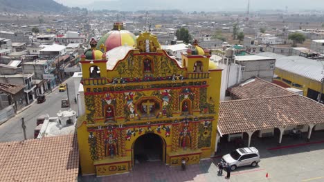 Ornate-façade-of-Mayan-Church-in-San-Andres-Xecul,-Guatemala,-aerial