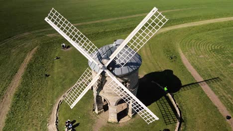 landmark chesterton historic wooden sail windmill aerial orbit birdseye right view above rural english countryside