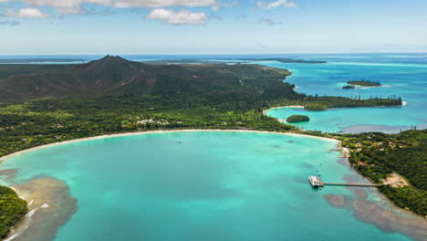 aerial parallax, time lapse over kuto bay, ise of pines, n'ga peak in background