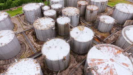 rusty industrial storage containers seen from above, cinematic drone movement