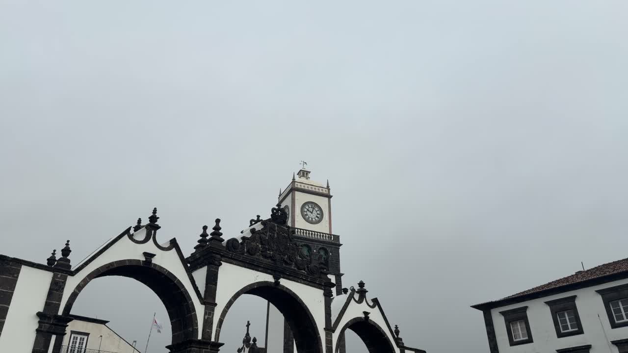 Stone arches and clock tower in Ponta Delgada São Miguel Island Azores