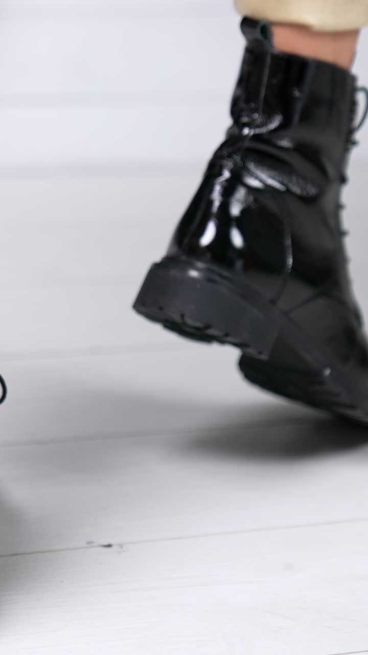 Rotating woman shoes showroom. Boutique lifestyle posing in store. Vertical video