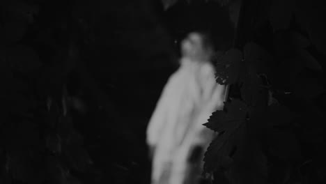 person in hazmat suit in a forest