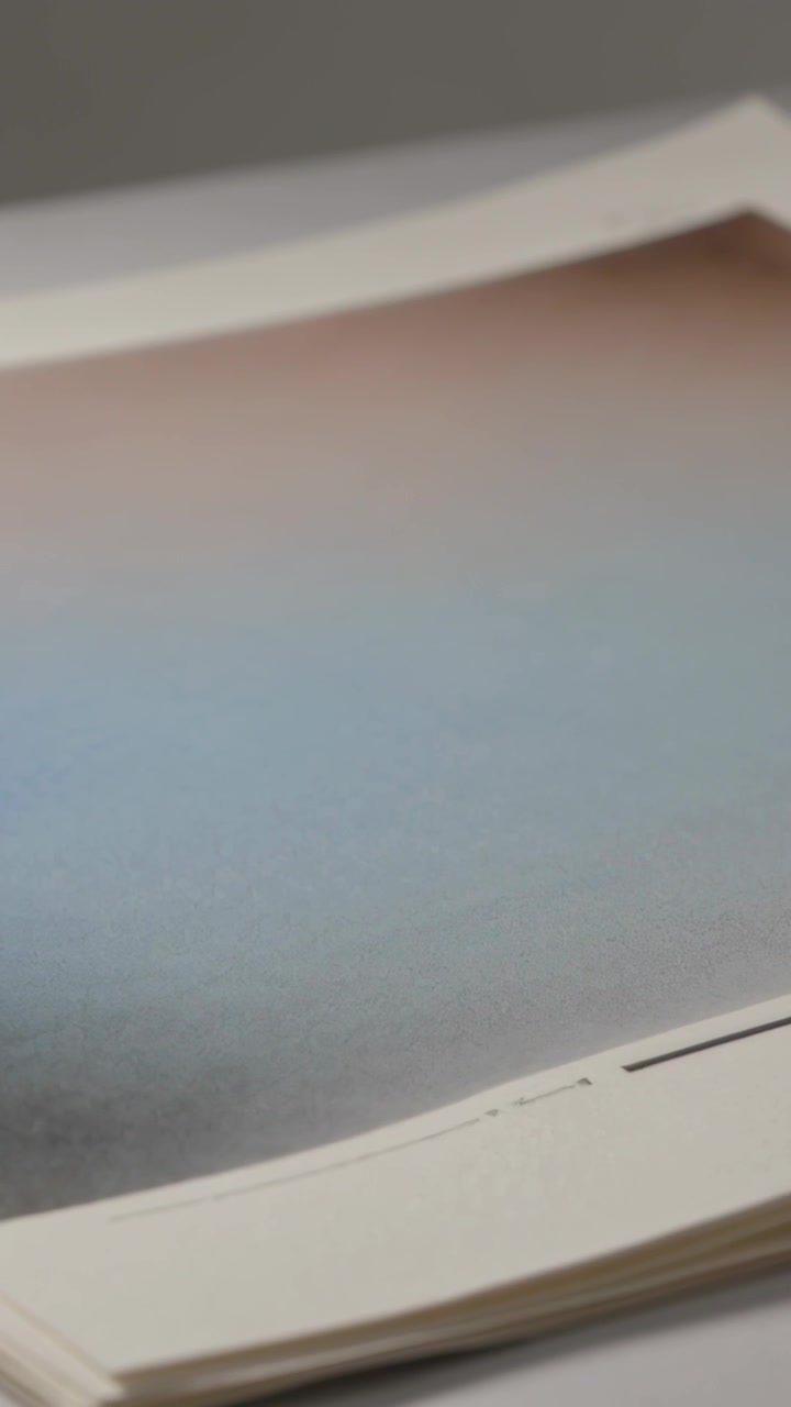 Vertical video: Starting slow camera shift revealing print stack on light table, showing crop marks