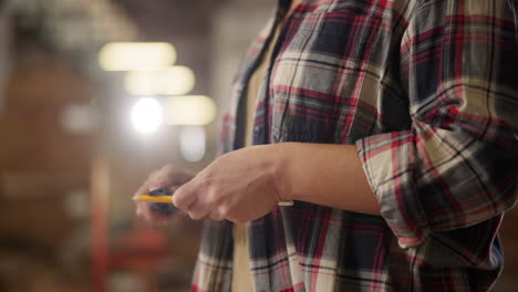 hands using a utility knife for crafting