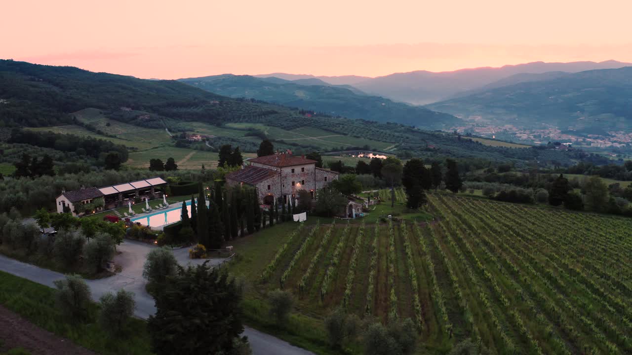 Aerial View Of A Tuscan Villa Surrounded By Vineyards In Italy At Sunset, Sunrise