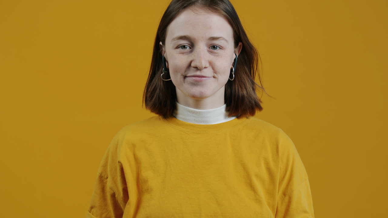 Young Woman Wearing Earbuds