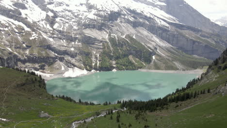 fast rise over the hill side towards the alpine lake oeschinensee in the bernese oberland, switzerland