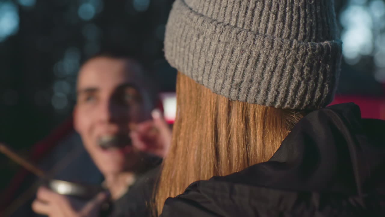 Close up emotional moment captured as yoga specialist wearing blindfold gently embraces partner standing barefoot on nail board in peaceful studio showing mindfulness trust healing support