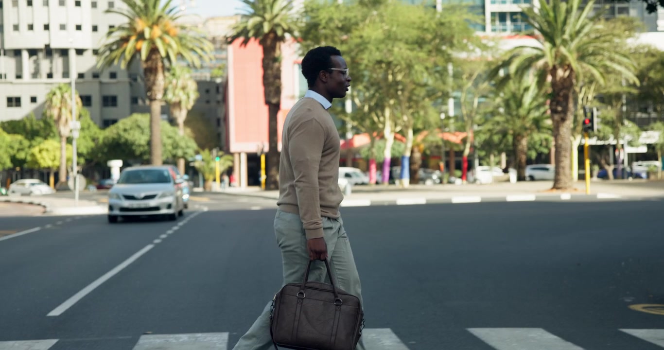 Businessman Walking Across City Street with Leather Bag