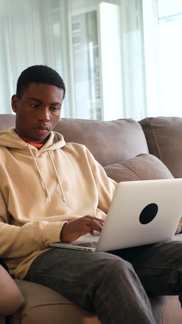 Man working on laptop at home