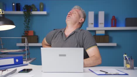 home office worker man has lower back pain.
