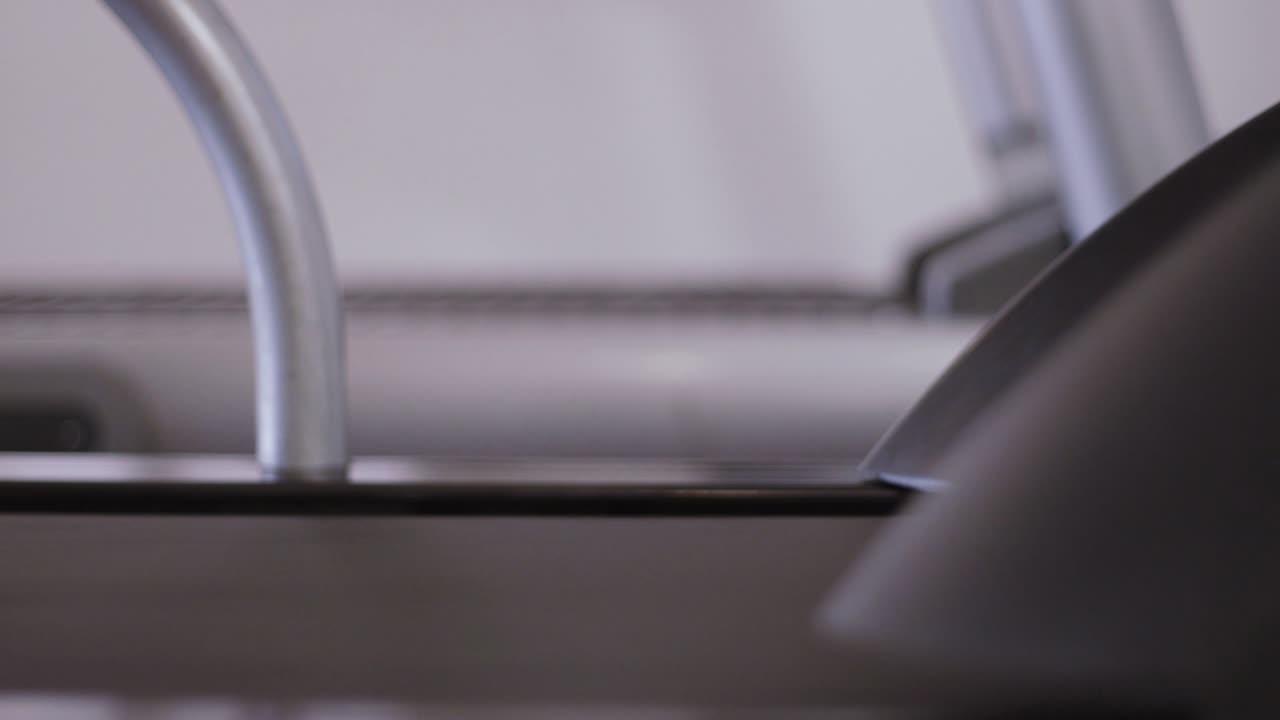 Person Running on a Treadmill at the Gym