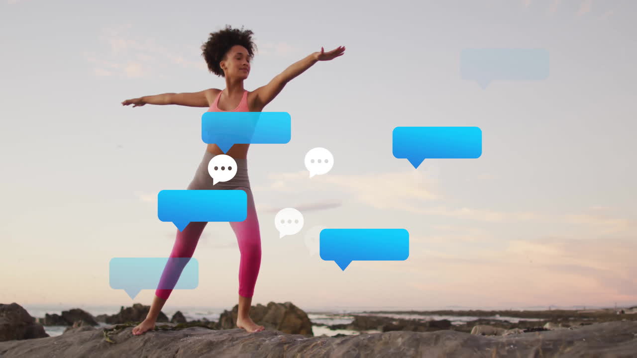 Female yoga practitioner holding Warrior II pose on rocky coast, with health data chat bubbles