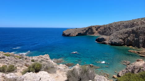 scenic coastal landscape with crystal clear blue water and rocky cliffs