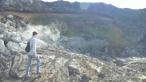 person walking in vulcano landscape in iceland