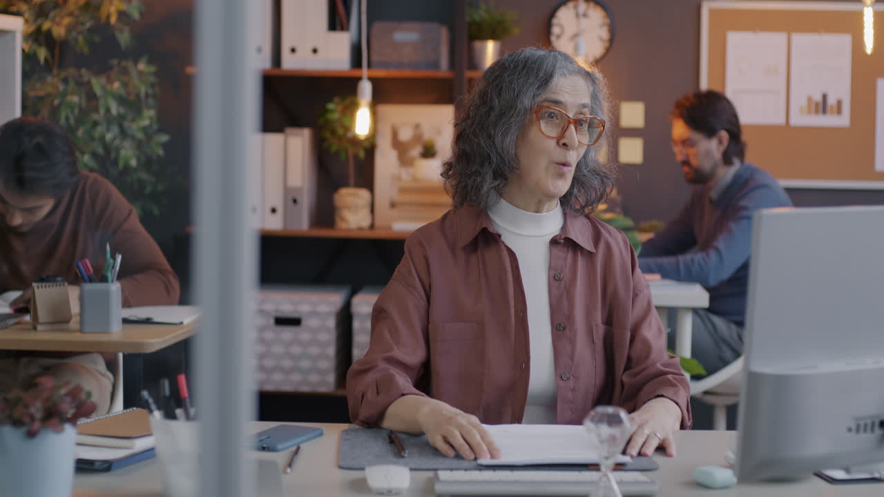 Businesswoman in meeting with colleagues