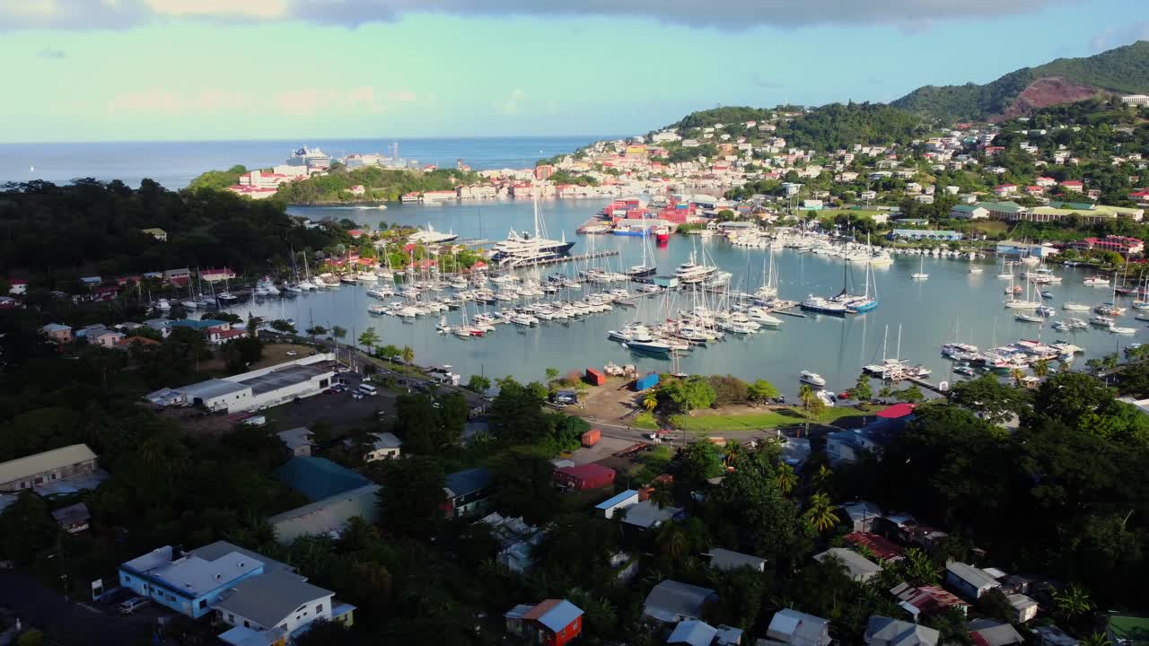 Grenada St. George Harbour aerial pan with hillside houses