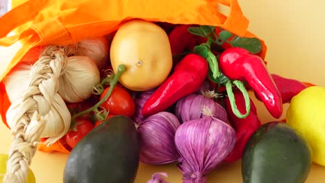 assortment of fresh vegetables in an orange bag