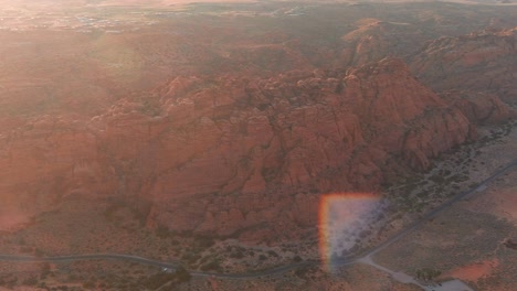 aerial shot of snow canyon's main road weaving through the mountainous landscape