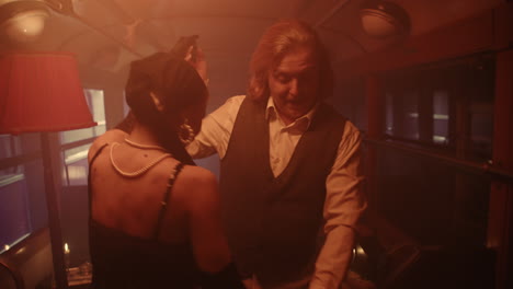 vintage couple dancing in a train car