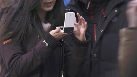 young couple using camera in tokyo