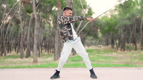 young man dancing street dance in a park