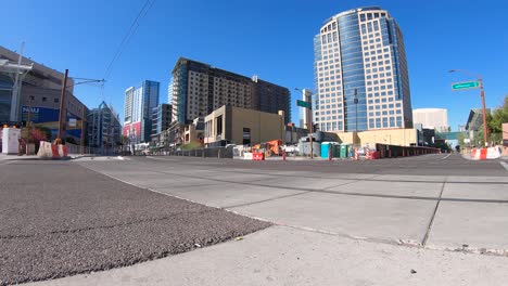 time-lapse, a low angel of traffic moving between high rises, on washington street, phoenix, arizona