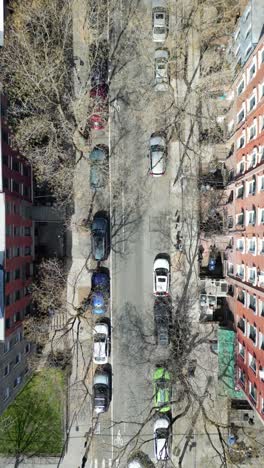 top-down vertical drone footage of clinton street, brooklyn, showcasing an aerial perspective of the street, buildings, and traffic flow.