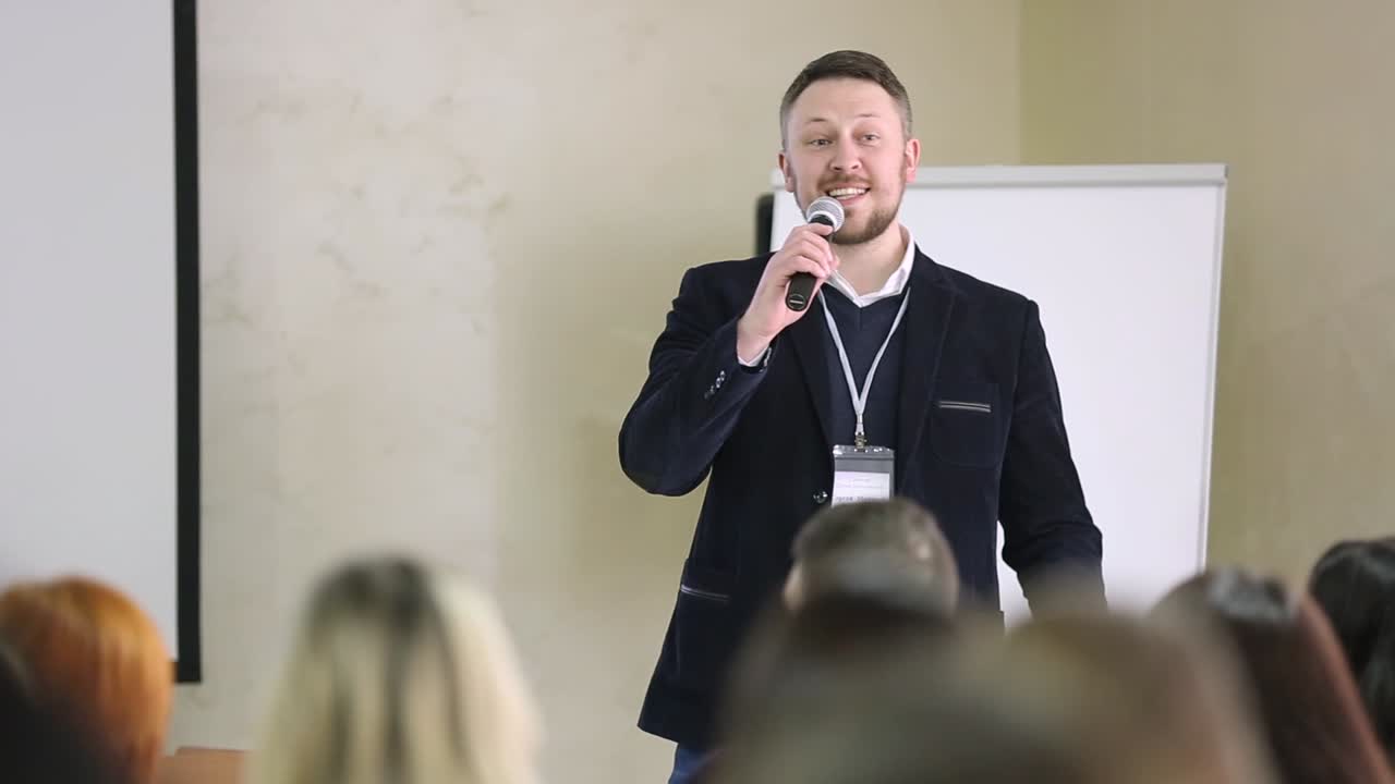 Public Speaker Giving Talk At Business Event. Public Speaker Giving Talk At Business Event