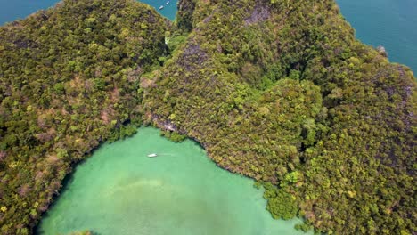 Hong-Island-Krabi-Thailand-Lagoon-with-boats-and-beaches--aerial-ascending-reveal