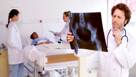 Doctor-examining-xray-in-the-ward