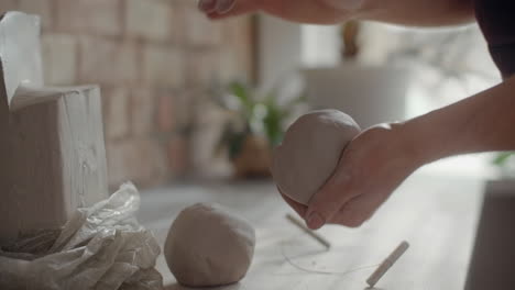 sculpting clay by hands