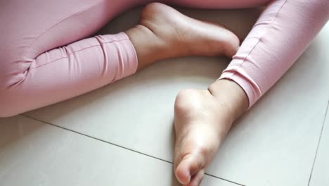 child playing with feet