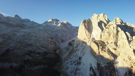 mountain summit in the albanian alps hiking between valbone and theth in albania during sunset