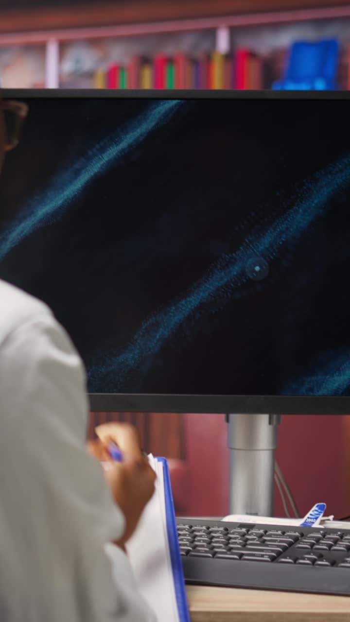 Vertical video Student doing online learning for career business development, taking notes