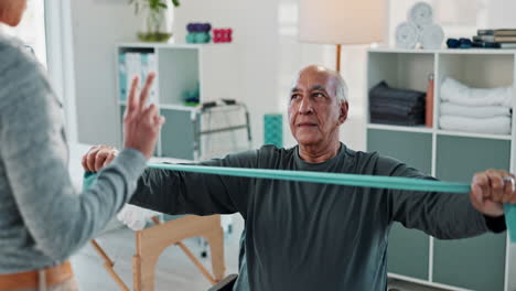 senior man doing physical therapy exercises with a therapist