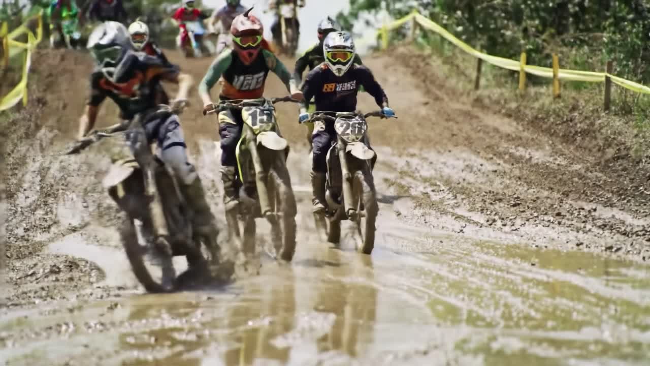 Motocross Race in Muddy Conditions