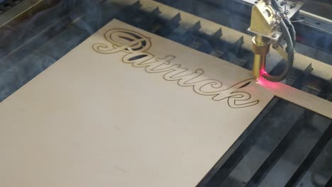 cnc laser cutting machine cuts wooden plank and plywood