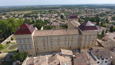 chateau de castries castle in south of france with residential area in the back