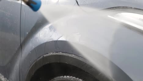 rinsing car fender blue silver