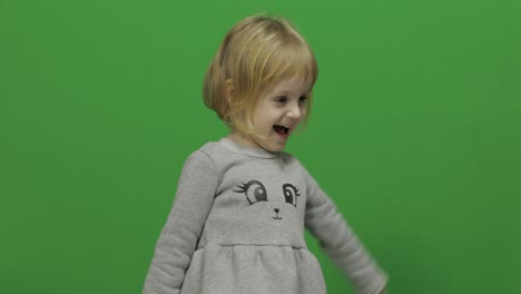 Kid-girl-on-a-Green-Screen,-Chroma-Key.-Happy-three-years-old-girl