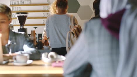 cafe, coffee shop and barista serving a customer