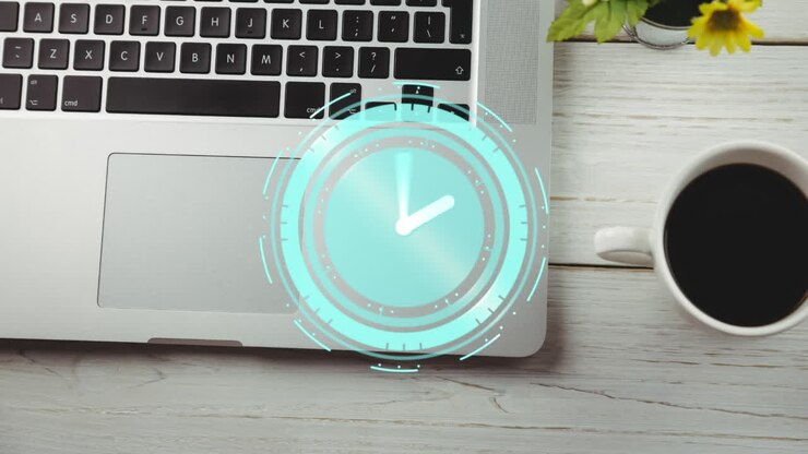 Animation of clock moving over desk with coffee and laptop