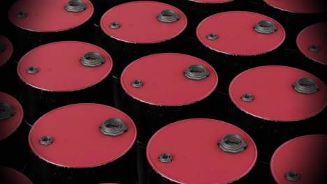 video of multiple red barrels on black background