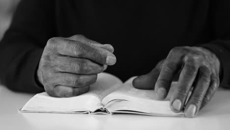 praying to god with hands together with bible on white background with people stock video stock footage