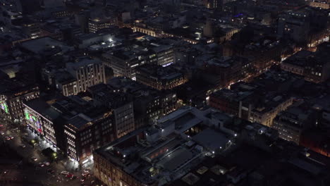aerial night shot of mexico city center. zocalo and madero street with christmas lights,