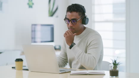 Mixed-race-creative-entrepreneur-using-a-laptop