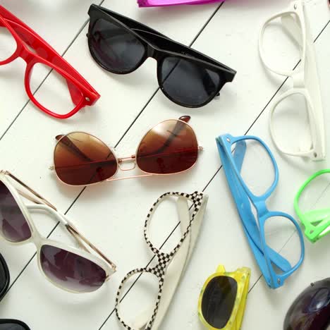 collection of various style and color sunglasses and frames captured from above